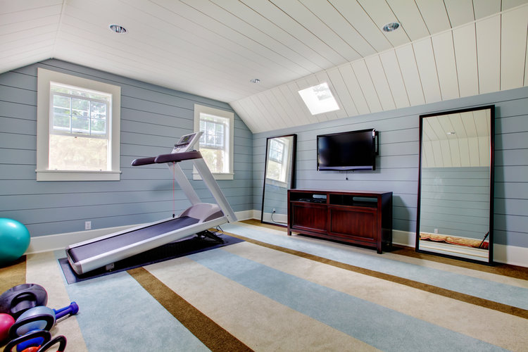 Home gym in a large blue room.