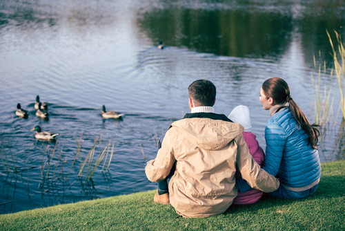family by duck pond